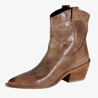 Brown cowboy boot on a white background