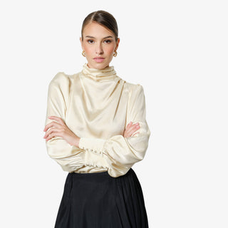 Champagne satin mock neck blouse with puff sleeves and draped neckline