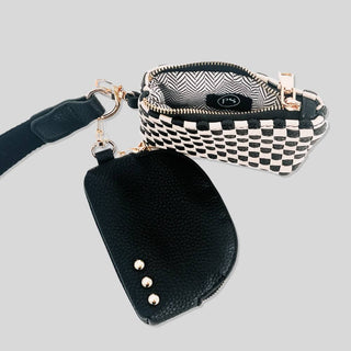 Wonderlust Dual Pouch Wristlet in black and cream checkered with gold zippers and wide strap