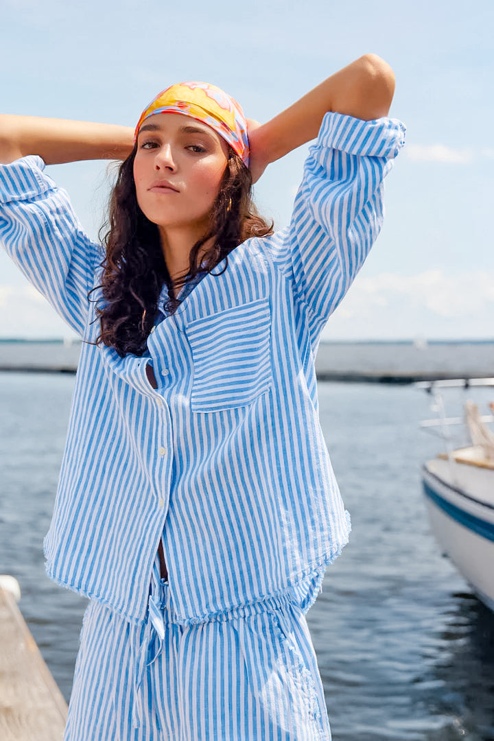 Stylish and versatile blue pencil stripe button-up shirt by Melissa Nepton , perfect for adding a touch of sophistication to your wardrobe.-