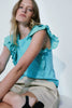 Melissa Nepton Marabella Top featuring a green frill sleeve and ruffles on the soft feel bodice . A great spring 2024 top.