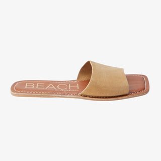 Cream slide sandal with 'BEACH' text on a white background