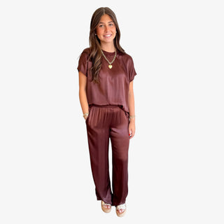 Woman wearing the silky Michael Stars Cyrus Pant and matching Michael Stars Flow Tee in expresso .