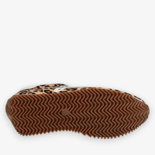 Close-up of a shoe sole with leopard print pattern on a white background