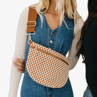 Woman wearing a Pretty Simple Westlyn Woven Bum Bag in checkered brown and cream with gold zipper, styled with white top and denim jeans.