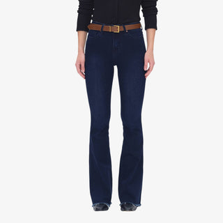 Woman wearing Mid Rise Flare Jeans in deep-water indigo denim with brown belt and black top, styled with heeled boots.