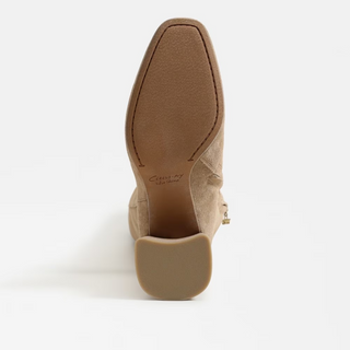 Beige suede shoe on a white background
