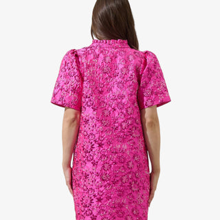 Fuchsia jacquard mini dress with puff sleeves, floral texture, and metallic shimmer for a bold, feminine statement look.