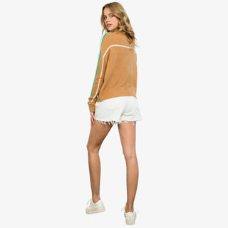 Camel sweater with green and white stripe sleeves and mock neckline