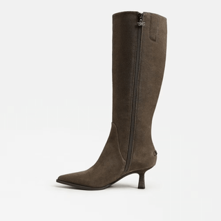 Brown knee-high boot with a zipper on a white background