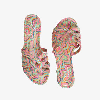 Colorful psychedelic print slide sandals with ruched straps and flat sole.