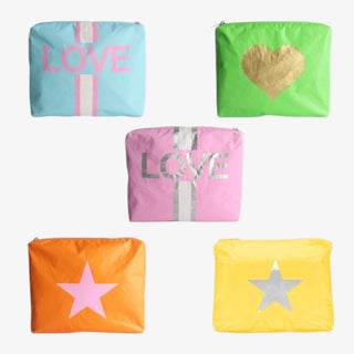 Colorful Tyvek Travel Makeup Bags on a white background