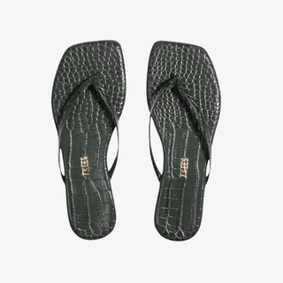 Pair of dark green croc-embossed square toe flip flop sandals with slim straps displayed on a light gray background.
