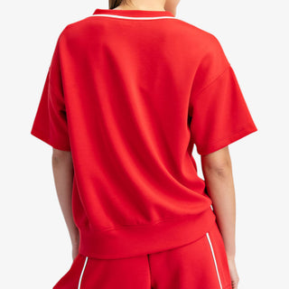 Shop red scuba V-neck top with contrast piping—sporty, flattering athleisure style perfect for everyday wear or matching sets.