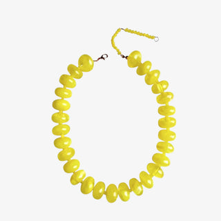 Yellow chunky beaded necklace with glossy oversized resin beads front view