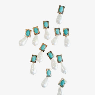 Turquoise and pearl drop earrings with gold accents and oversized pearl design front product view