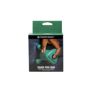 Green body massager in packaging with visible brand name on a white background