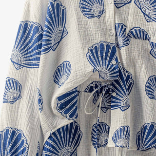 Seashell print gauze short set close up detail of blue shell pattern, button front top, and drawstring waist shorts