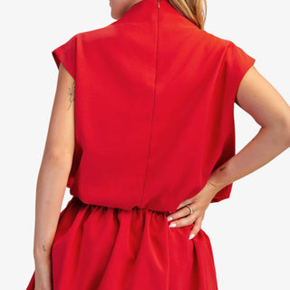 Mock neck balloon top in red with modern draped fit and cap sleeves