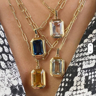 Woman wearing sapphire gemstone and crystal gemstone .