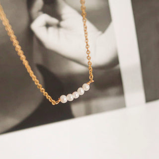 18K gold non-tarnish petite pearl choker necklace with delicate chain and small pearl cluster detail