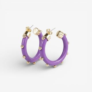 Purple hoops with gold accents on a grey background.