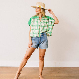 Green floral button front top relaxed fit lightweight blouse front view styled with denim jeans