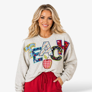 Queen of Sparkles Apple Teach Sweatshirt apple graphic detail colorful lettering close-up front view
