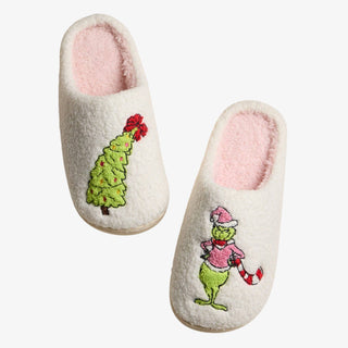 Whimsical Green Monster Slippers with pink sherpa lining and embroidered Christmas designs