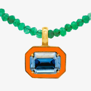 Orange pendant necklace blue stone green bead chain gold setting close up view