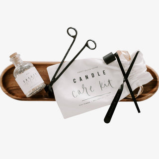 Candle care kit matte black tools wick trimmer snuffer dipper flat lay top view