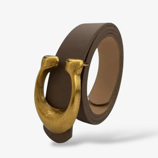 Smooth leather belt available in brown, black, and white, featuring a bold gold C shaped buckle for a chic, statement accessory to elevate any outfit.