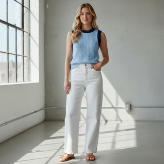 Michael Stars blue sleeveless knit sweater tank with textured fabric and contrast trim paired with denim jeans