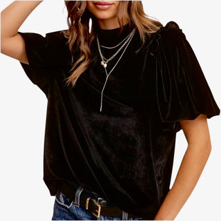 Woman wearing Velvet Whisper Jet Black Top with flutter sleeves and mock neckline