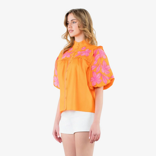 Close-up of puff sleeve detail on the Flora Embroidered Top with pink floral embroidery