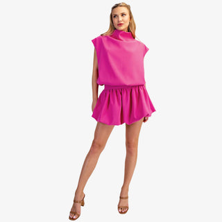 Mock neck balloon top in hot pink with draped silhouette and cap sleeves
