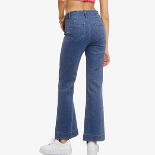 Woman wearing high rise kick flare dark wash denim jeans with cropped wide leg fit