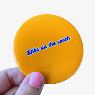 3-inch Dibs on the Coach game day button with blue script lettering on a solid gold background, front view