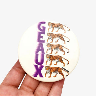 3-inch Geaux Tigers game day button with stacked purple lettering and five tiger illustrations on a white background, front view