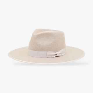 Beige hat with a ribbon on a white background