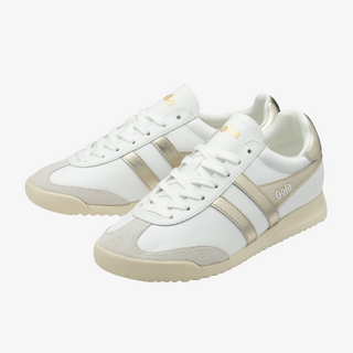 White sneakers with beige accents on a white background