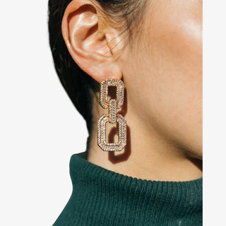 Gold rectangular double-link statement earrings with baguette and round CZ stones, adding sparkle and elegance for formal and evening looks.