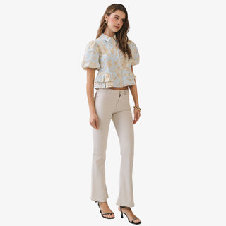 Blue floral peplum top with puff sleeves and collared button front detail styled with neutral high waisted pants