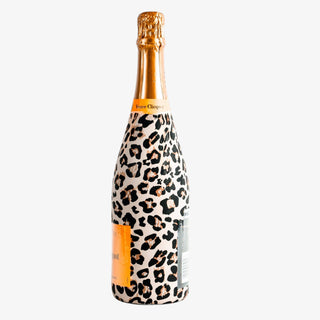 Bottle of champagne with leopard print design on a white background