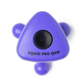 Purple triangular device with a black button labeled 'SQUID PRO QUO' on a white background