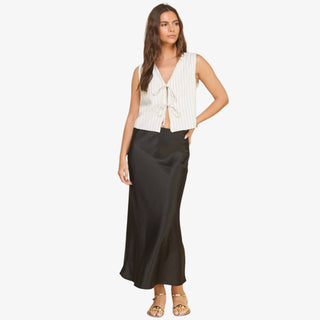 Black satin slip skirt with midi length and smooth drape on model