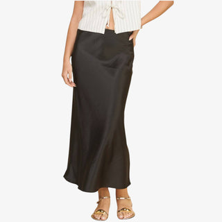 Person wearing a black skirt on a white background