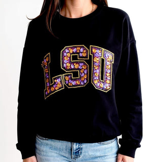 Woman wearing Queen of Sparkles Multi Jewel Sweatshirt in black with jeans.