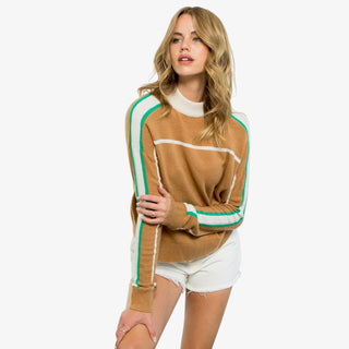 Camel sweater with green and white stripe sleeves and mock neckline