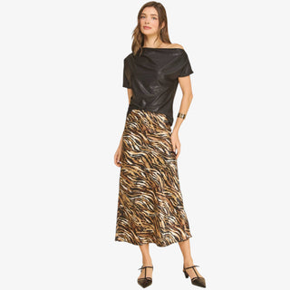 Black one shoulder top with relaxed draped neckline and subtle shimmer for dressy and evening outfits.